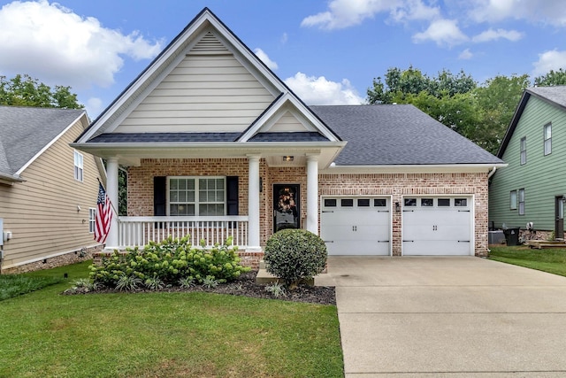 craftsman-style home featuring a garage, a shingled roof, a porch, and brick siding