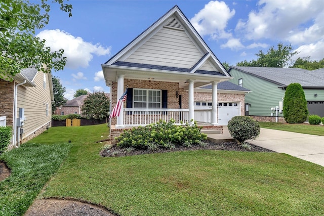 view of front facade featuring an attached garage, covered porch, brick siding, driveway, and a front yard