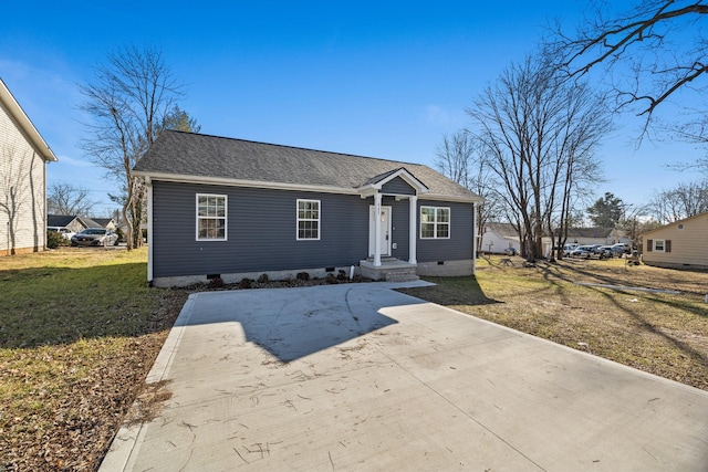 bungalow with crawl space, a shingled roof, and a front yard