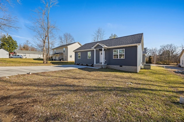 view of front of home with driveway, a front lawn, crawl space, and cooling unit