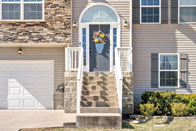 property entrance featuring stone siding