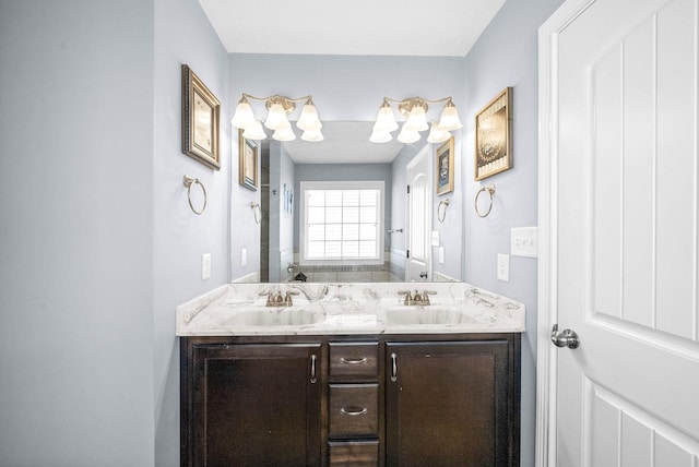 bathroom with double vanity and a sink