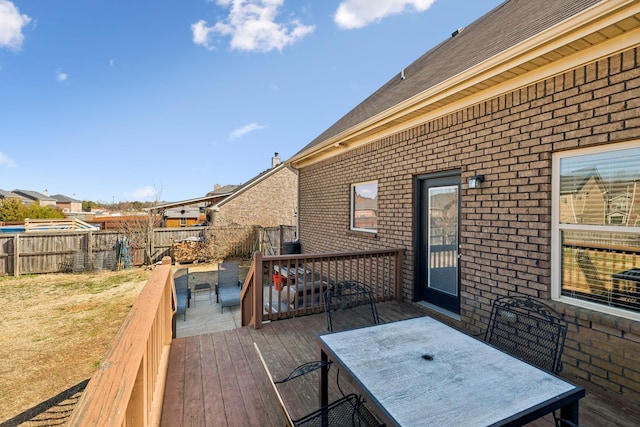 wooden deck featuring outdoor dining area and fence