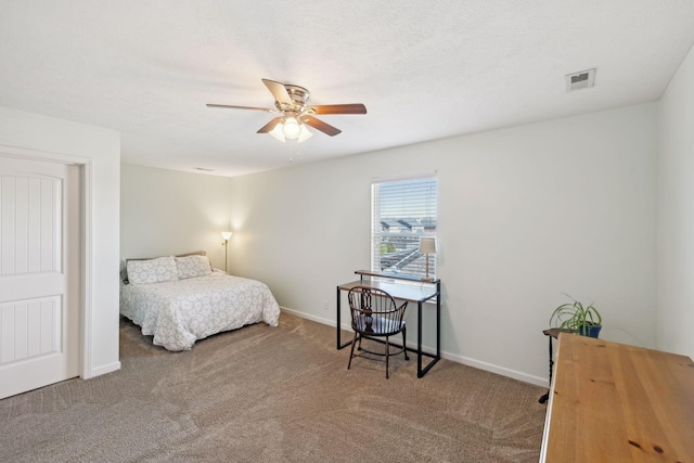 bedroom with a ceiling fan, carpet flooring, visible vents, and baseboards