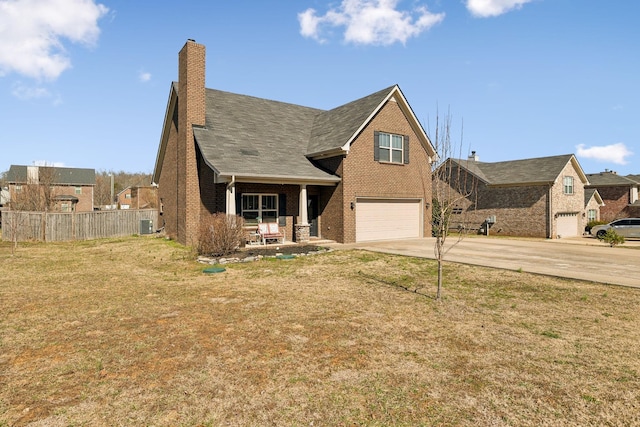 view of front of property with driveway, an attached garage, fence, a front lawn, and brick siding