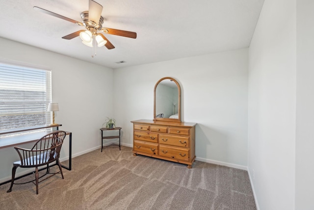 sitting room featuring a ceiling fan, carpet flooring, visible vents, and baseboards