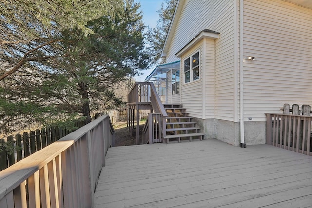 wooden terrace featuring stairs and fence