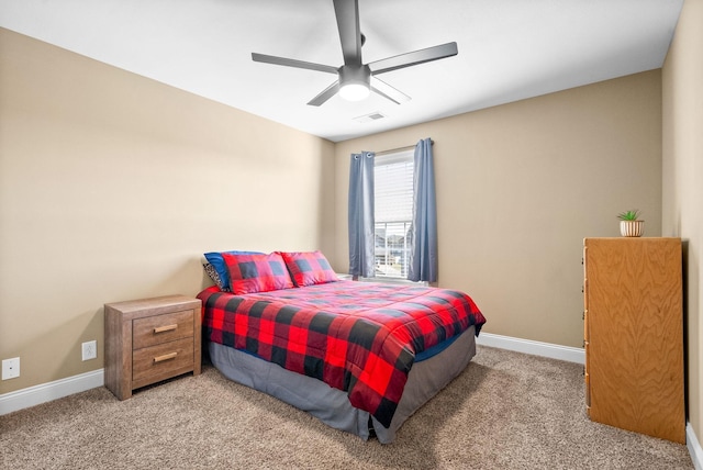 bedroom with carpet floors, visible vents, ceiling fan, and baseboards