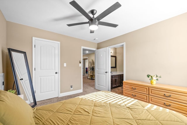 unfurnished bedroom with carpet floors, ceiling fan, baseboards, and connected bathroom