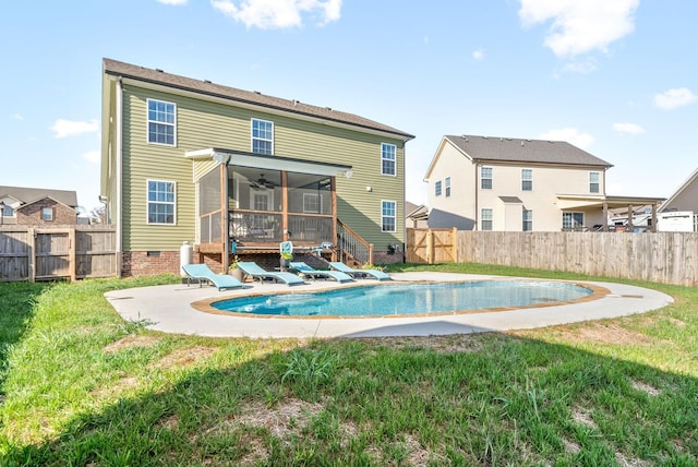 rear view of house with crawl space, a patio area, a fenced backyard, and a fenced in pool