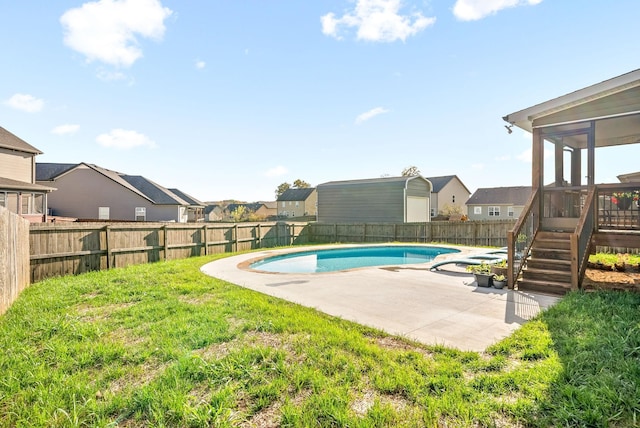 view of pool featuring a patio area, a fenced backyard, a residential view, and a fenced in pool