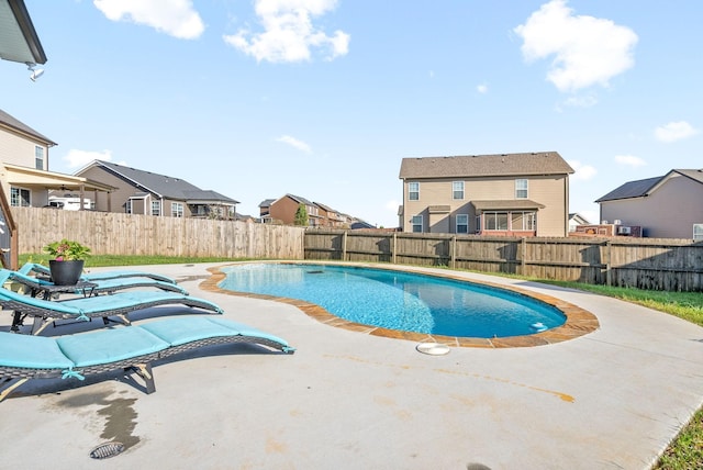 view of swimming pool featuring a patio, a fenced backyard, and a fenced in pool