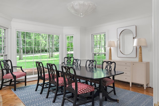 dining space with ornamental molding