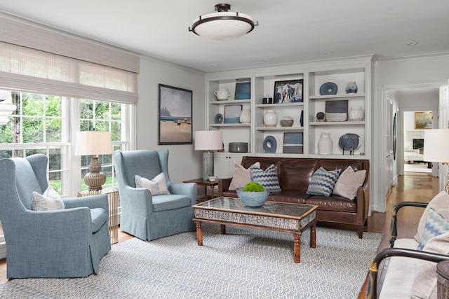 interior space featuring crown molding and wood finished floors