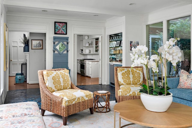 interior space with crown molding and wood finished floors