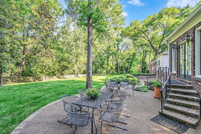 view of patio / terrace featuring french doors and outdoor dining space