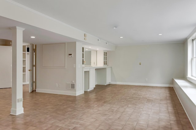 unfurnished living room with ornamental molding, recessed lighting, visible vents, and baseboards