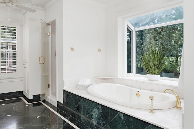 bathroom with marble finish floor, a garden tub, ornamental molding, ceiling fan, and a shower stall