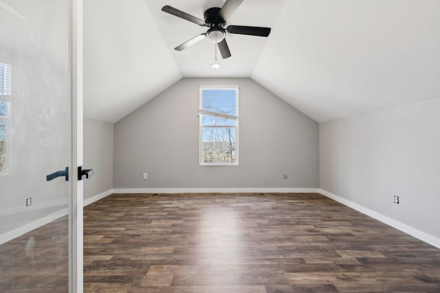 additional living space featuring lofted ceiling, ceiling fan, wood finished floors, and baseboards