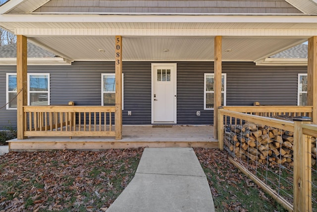 entrance to property featuring covered porch