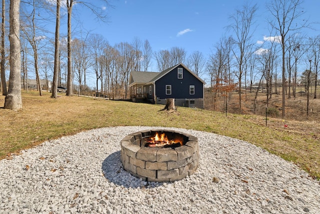 exterior space featuring an outdoor fire pit