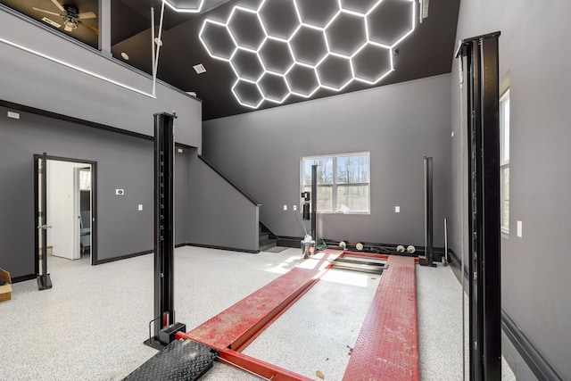 interior space featuring stairs and speckled floor