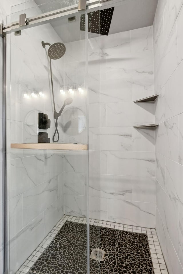 full bath featuring a shower stall