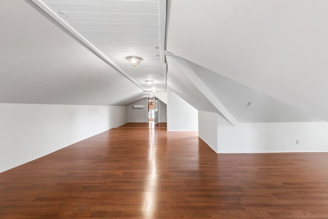 bonus room featuring lofted ceiling and wood finished floors