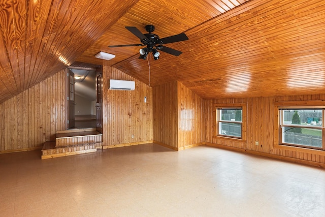 spare room featuring tile patterned floors, wood walls, and a wall mounted air conditioner