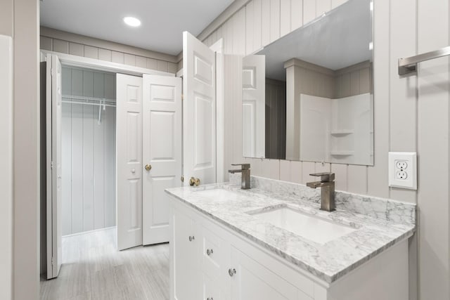 bathroom with double vanity and a sink