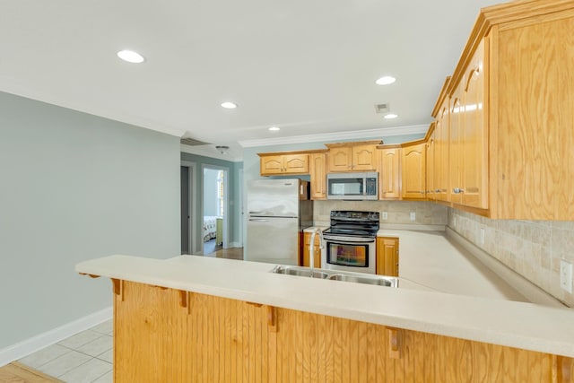 kitchen with stainless steel appliances, visible vents, a peninsula, and tasteful backsplash