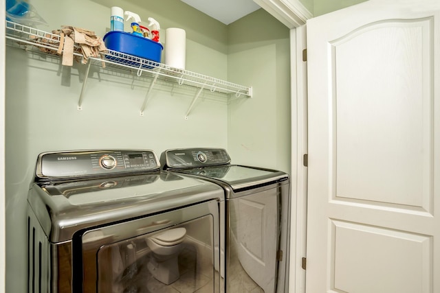 laundry room with laundry area and washer and clothes dryer