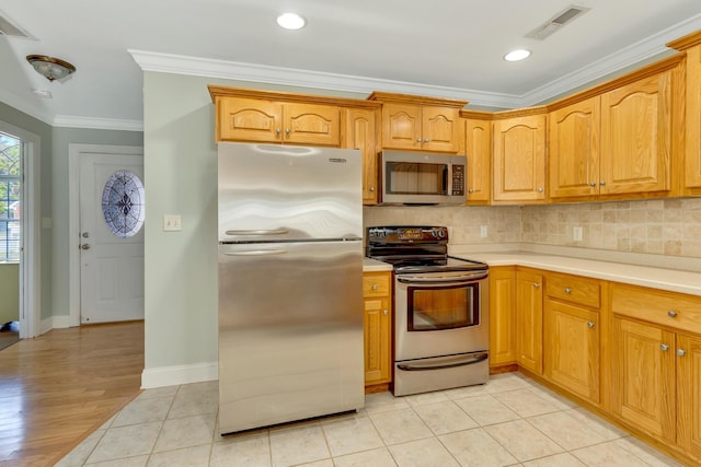 kitchen featuring visible vents, light countertops, ornamental molding, appliances with stainless steel finishes, and decorative backsplash