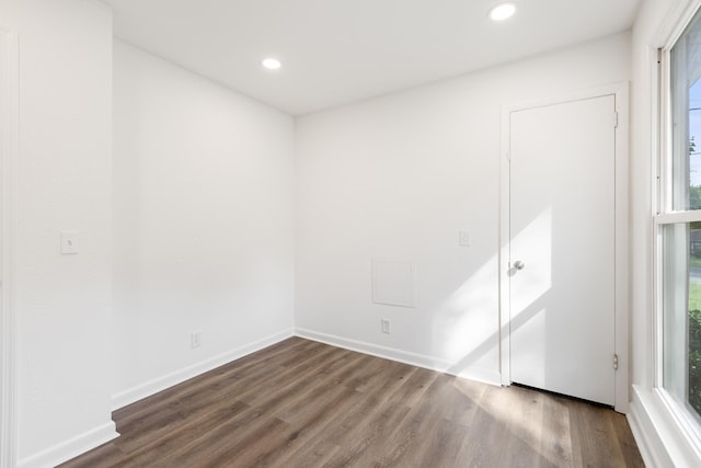 unfurnished bedroom featuring dark wood-type flooring, recessed lighting, and baseboards