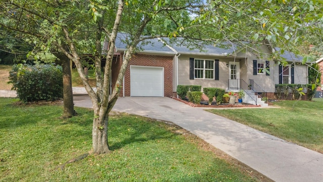 single story home with a front yard, brick siding, driveway, and an attached garage