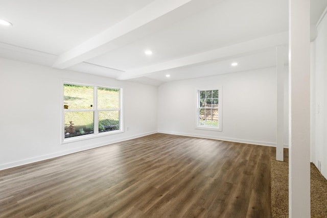 unfurnished room with plenty of natural light, baseboards, and dark wood-style flooring