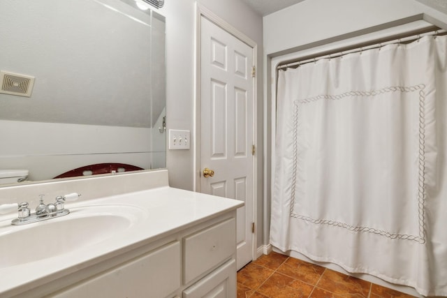 full bathroom with vaulted ceiling, vanity, a shower with shower curtain, and tile patterned floors