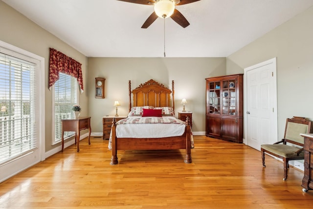 bedroom with ceiling fan, access to outside, light wood finished floors, and baseboards