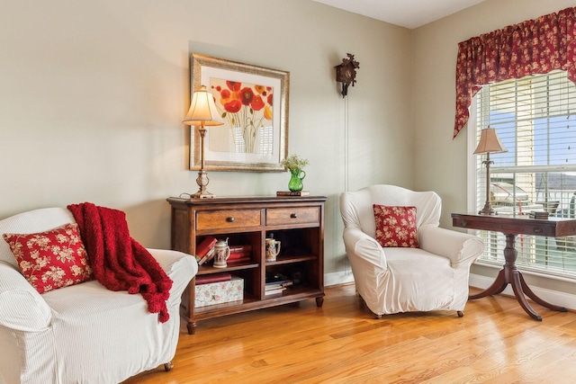 sitting room featuring light wood-style floors and baseboards