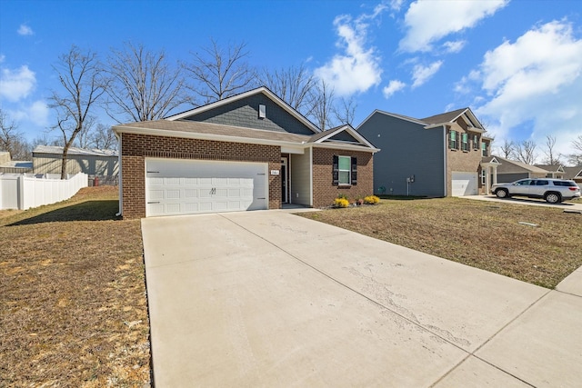 view of front facade with driveway, brick siding, an attached garage, fence, and a front yard