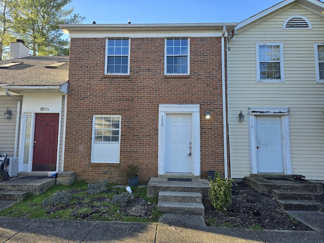 view of property with brick siding