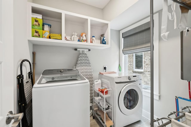 laundry area with laundry area and washing machine and clothes dryer