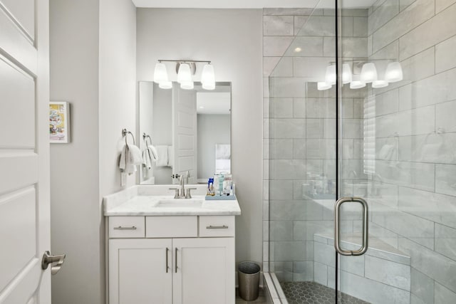 full bath featuring a stall shower and vanity