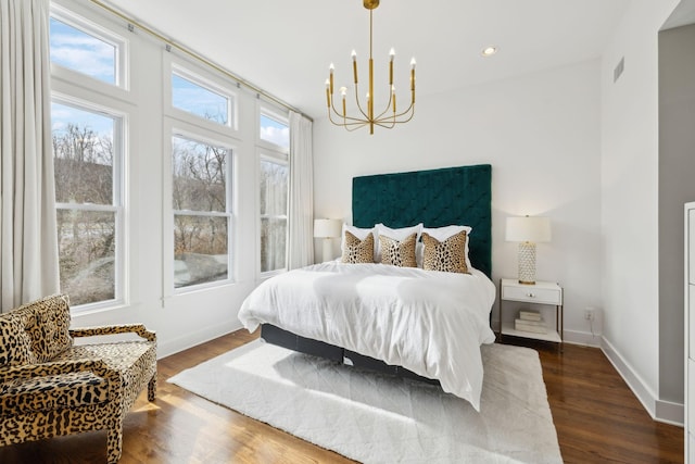 bedroom with visible vents, baseboards, dark wood-style floors, an inviting chandelier, and recessed lighting