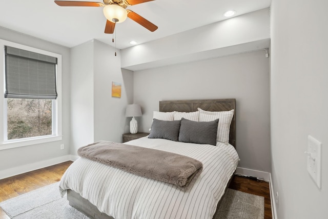 bedroom with ceiling fan, baseboards, wood finished floors, and recessed lighting