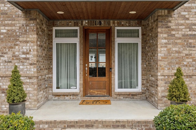 property entrance with brick siding