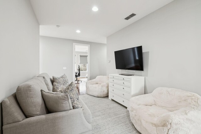 living room featuring visible vents and recessed lighting