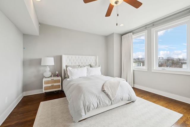 bedroom with a ceiling fan, recessed lighting, baseboards, and wood finished floors