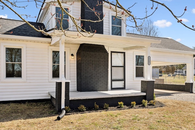 exterior space with a shingled roof