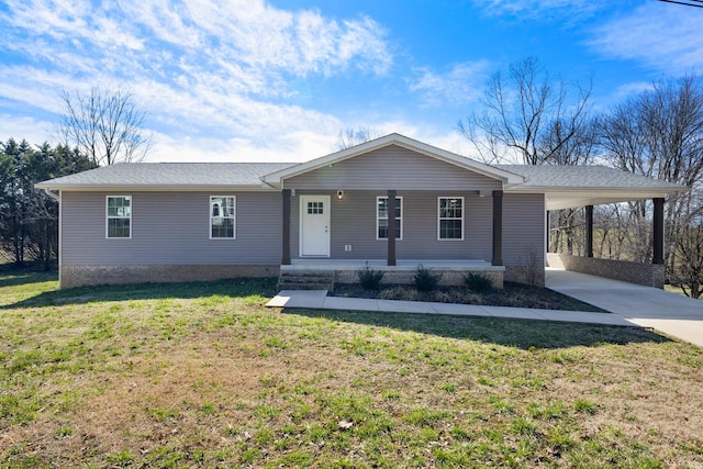 single story home with a carport, covered porch, a front lawn, and concrete driveway